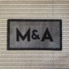 a grey doormat with a personalised monogram printed onto it in black